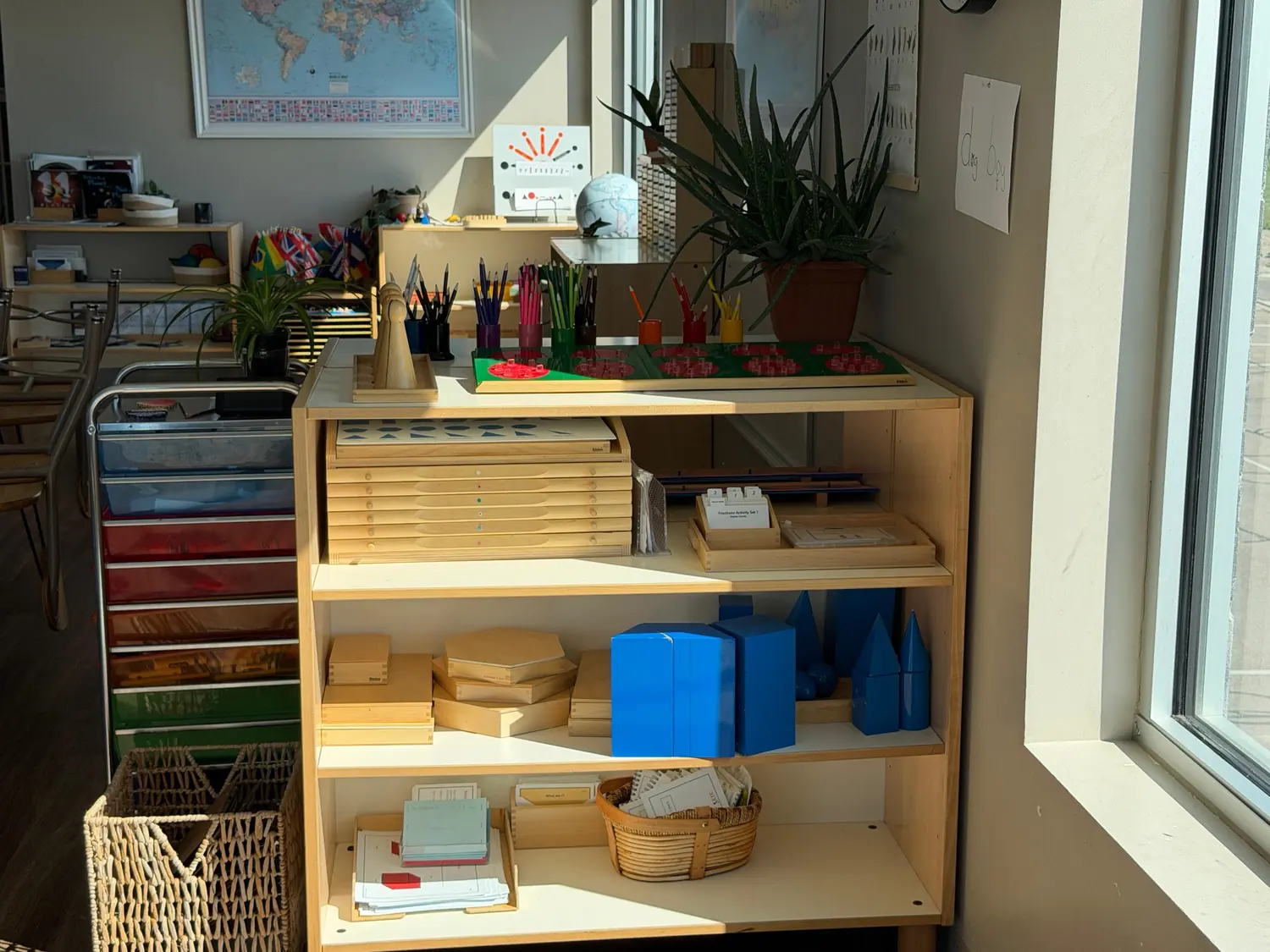 Montessori materials arranged on shelves