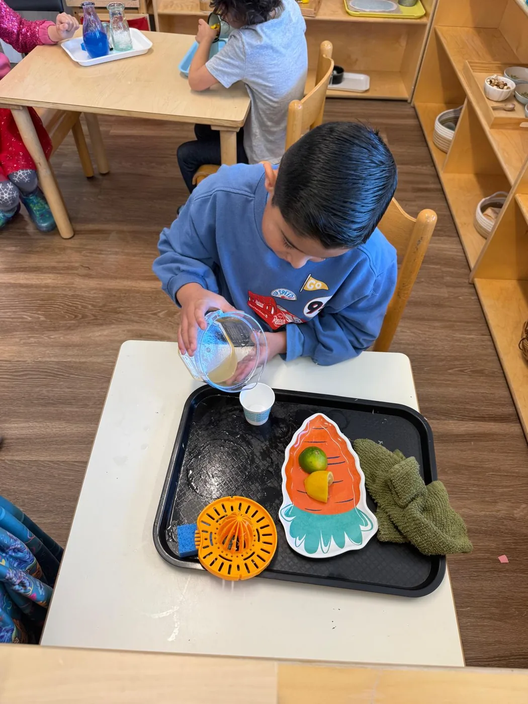 Student practicing pouring and measuring
